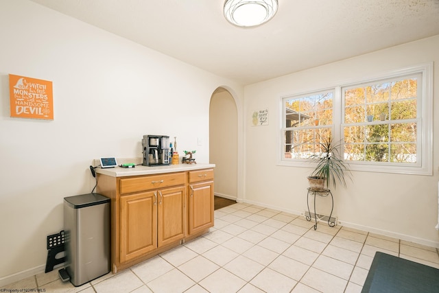 kitchen with light tile patterned flooring