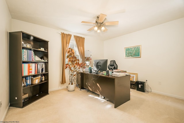 carpeted home office with ceiling fan