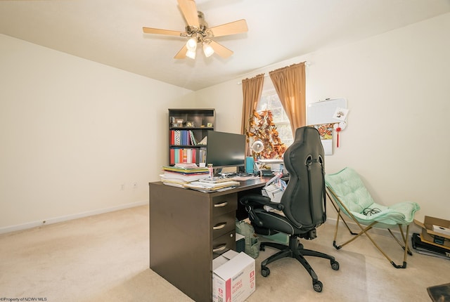 carpeted office space with ceiling fan