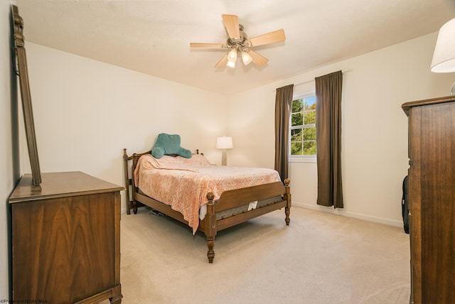 bedroom featuring light carpet and ceiling fan