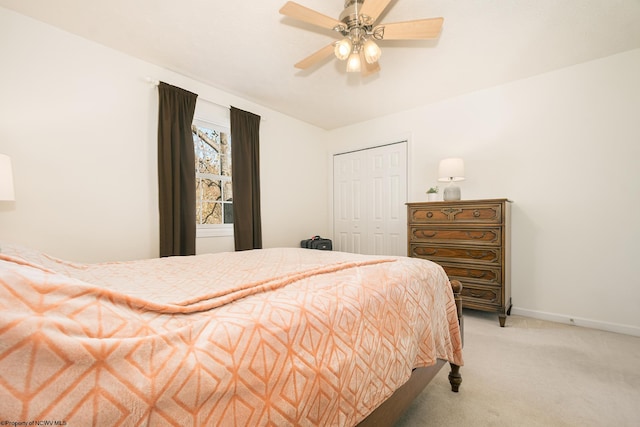 bedroom with a closet, carpet flooring, and ceiling fan