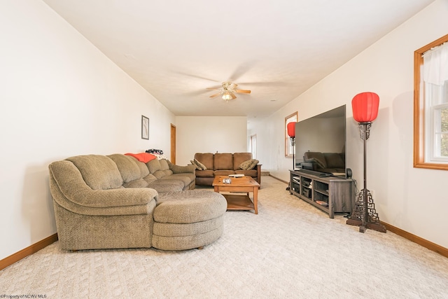 living room featuring ceiling fan and carpet floors