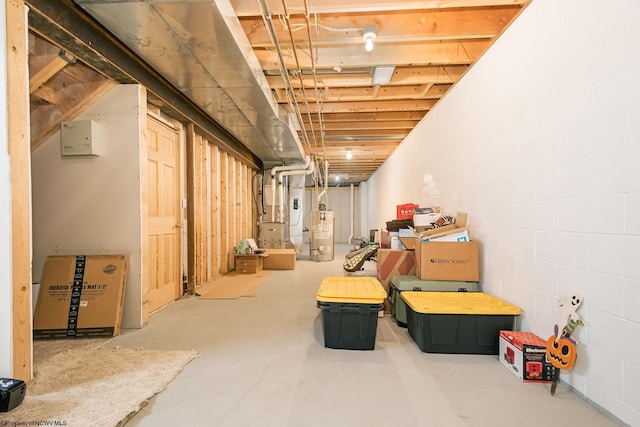 basement with water heater and heating unit