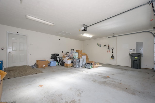 garage featuring a garage door opener and electric panel