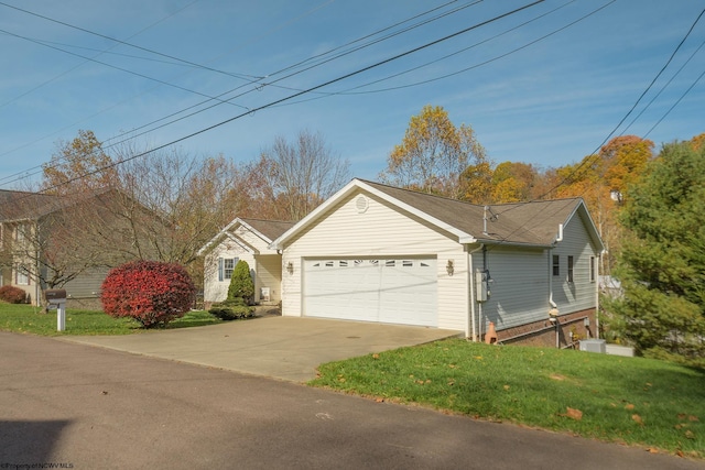 ranch-style home featuring a garage and a front lawn