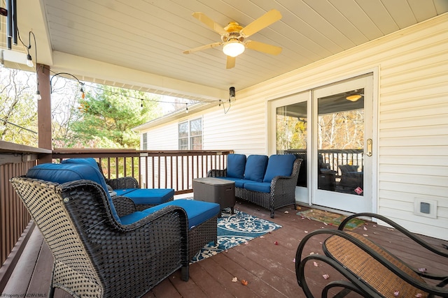 deck featuring ceiling fan and an outdoor living space