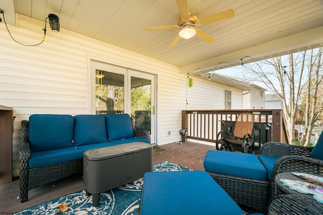 wooden terrace with outdoor lounge area and ceiling fan