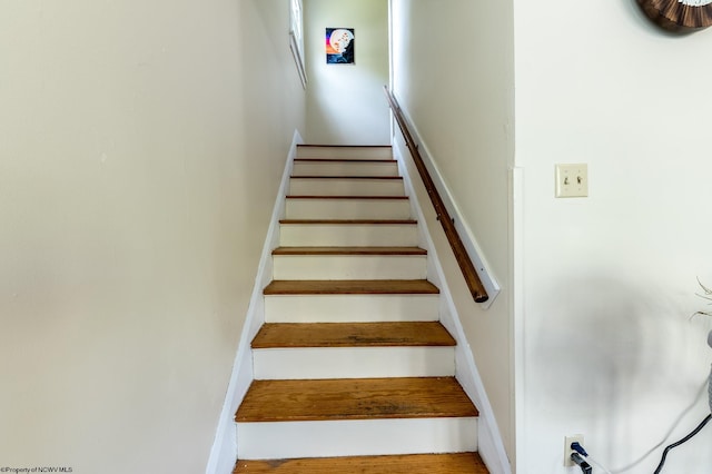 staircase featuring hardwood / wood-style floors