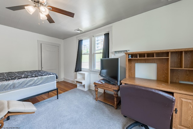 bedroom with hardwood / wood-style flooring and ceiling fan