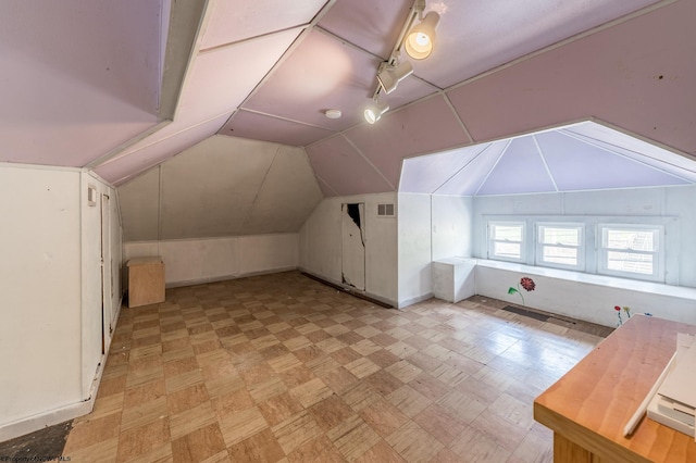 additional living space with lofted ceiling