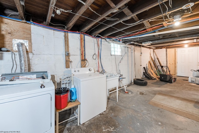 basement with sink and washer and dryer