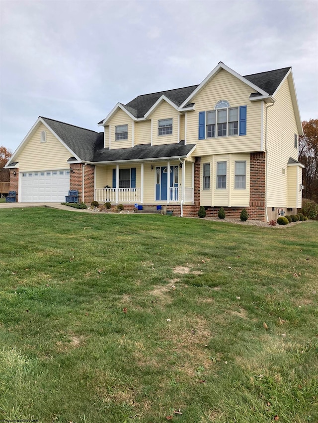 view of front of home featuring a front lawn, a garage, and a porch