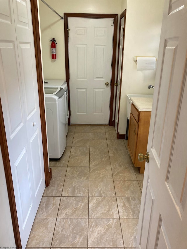 laundry area featuring light tile patterned floors