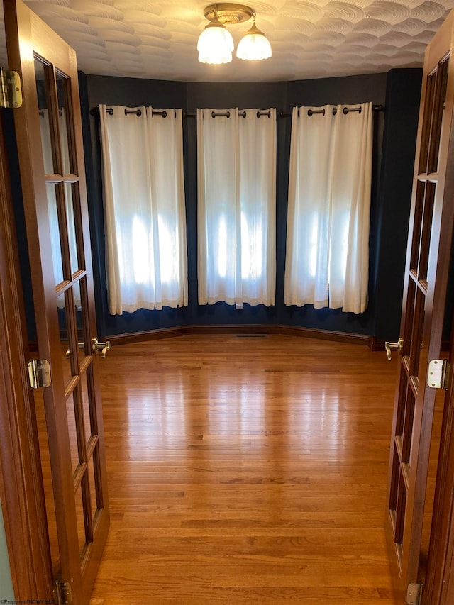 unfurnished room featuring light hardwood / wood-style flooring