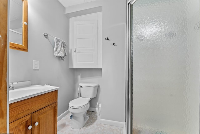 bathroom featuring walk in shower, tile patterned flooring, vanity, and toilet