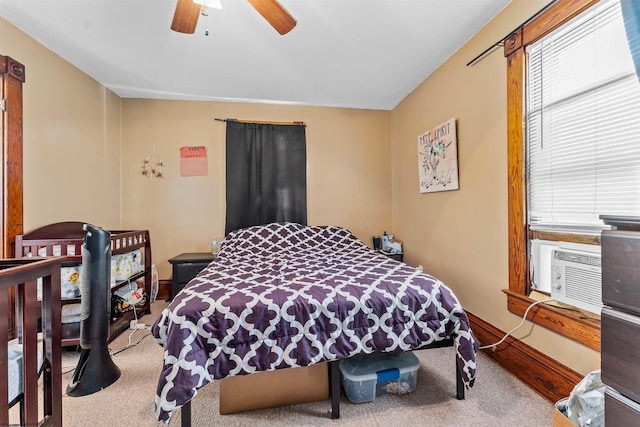 carpeted bedroom featuring ceiling fan