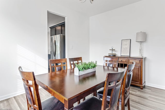 dining space featuring light hardwood / wood-style flooring