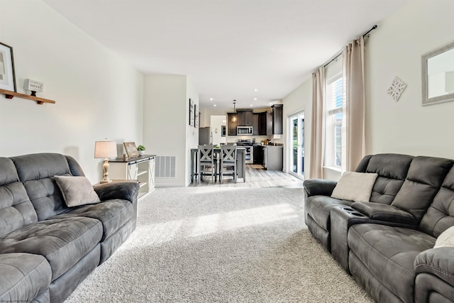 living room featuring light colored carpet