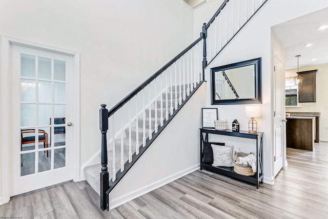 staircase featuring wood-type flooring