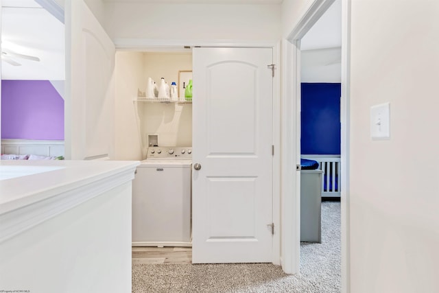 clothes washing area with ceiling fan, light wood-type flooring, and washer / clothes dryer