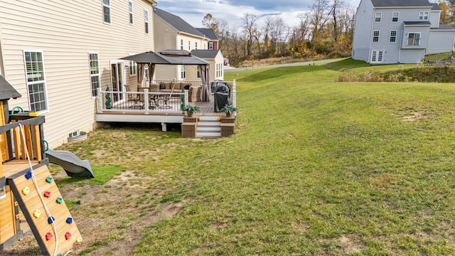 view of yard with a wooden deck