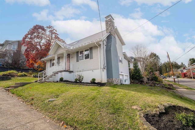 view of side of home with a yard