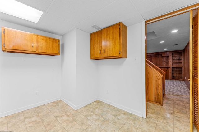 empty room with a paneled ceiling