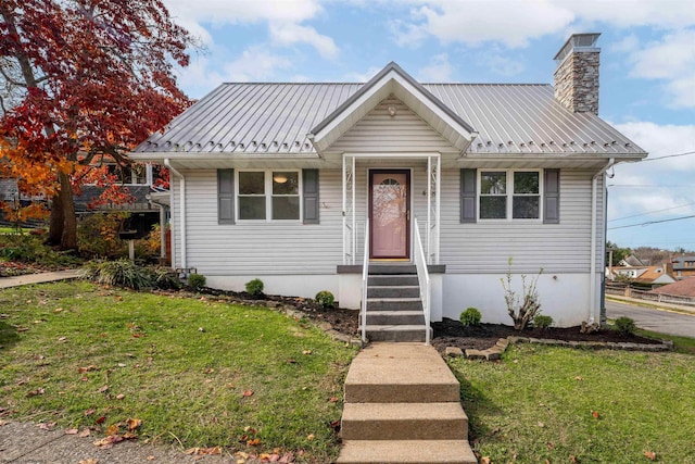 bungalow-style house with a front yard