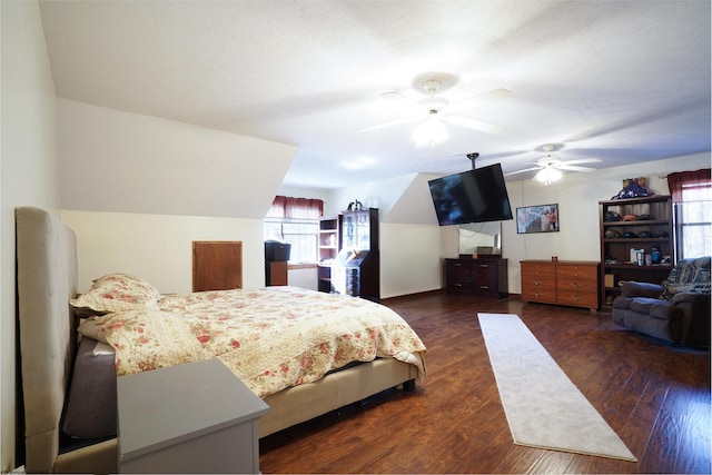 bedroom featuring ceiling fan and dark hardwood / wood-style floors