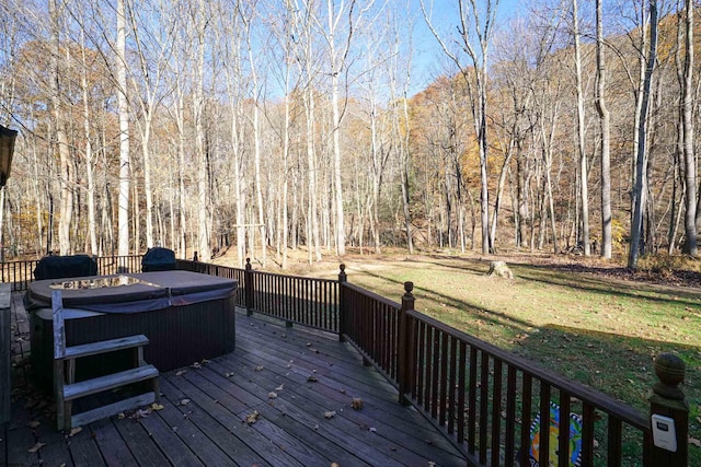 wooden terrace featuring a hot tub