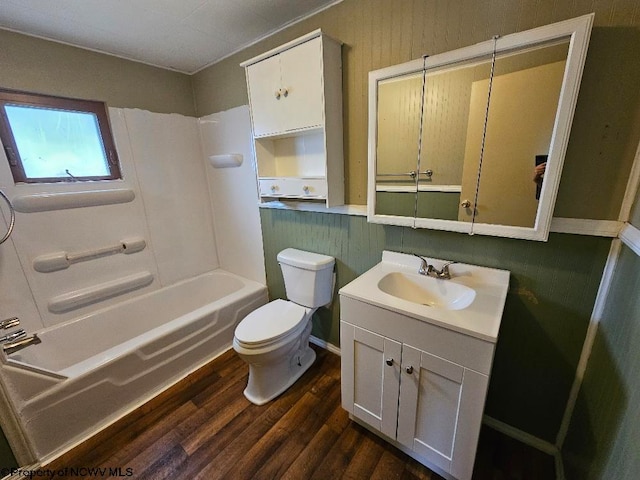 full bathroom with toilet, vanity, hardwood / wood-style floors, and shower / bathtub combination