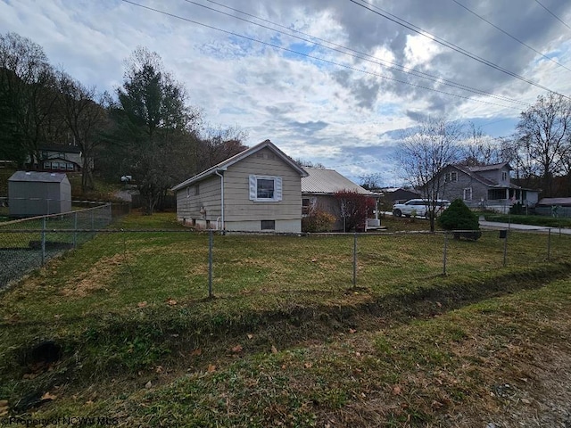 view of side of property with a lawn