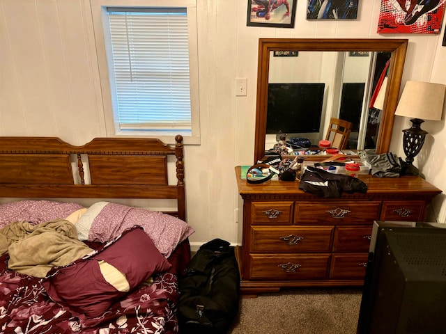 bedroom with dark colored carpet