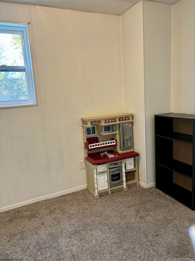 game room featuring carpet flooring and a textured ceiling