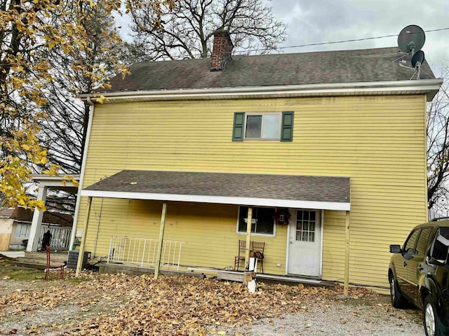 rear view of house with central AC