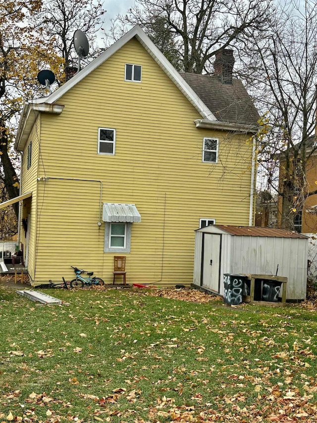 view of side of property with a lawn