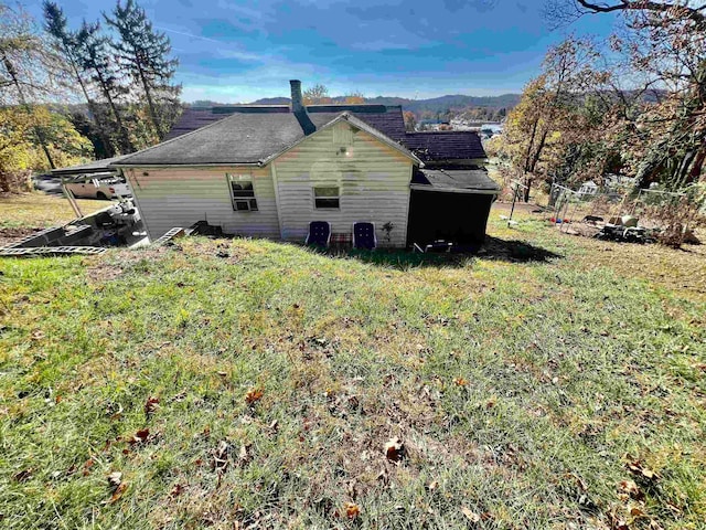 view of home's exterior with a lawn