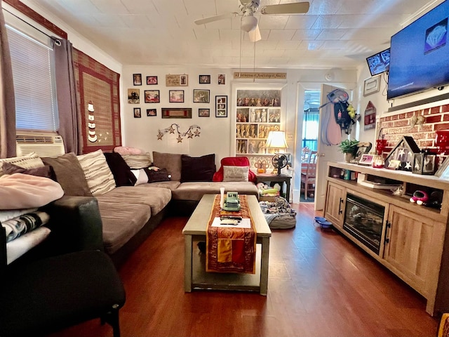 living room featuring dark wood-type flooring, ceiling fan, and cooling unit