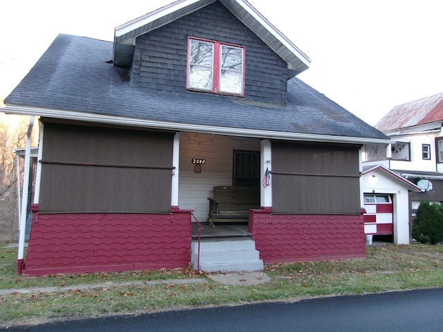 view of front of house with a garage and covered porch