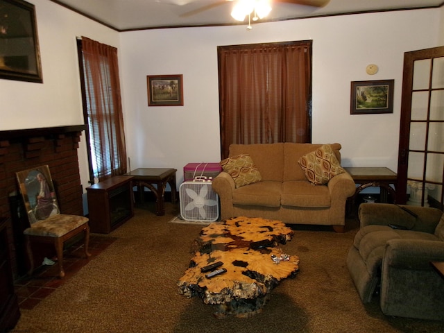 living room featuring a fireplace, ceiling fan, and dark carpet