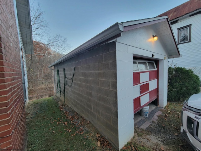 view of side of property with a garage