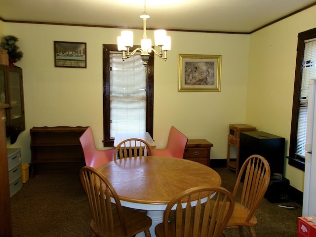 carpeted dining space with ornamental molding and a notable chandelier