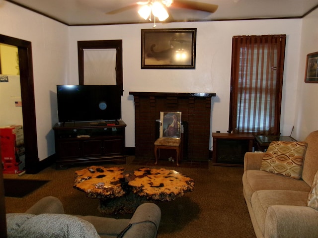 living room featuring a fireplace, ceiling fan, and carpet floors