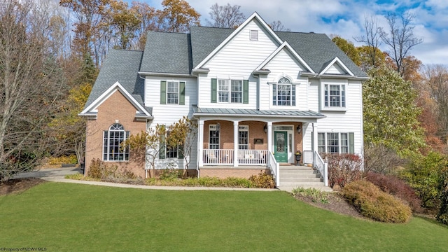 view of front facade with a porch and a front lawn