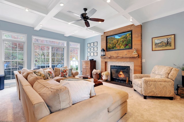 living room featuring a fireplace, a wealth of natural light, beam ceiling, and light carpet