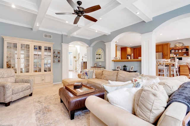 living room featuring ceiling fan, beam ceiling, crown molding, and coffered ceiling