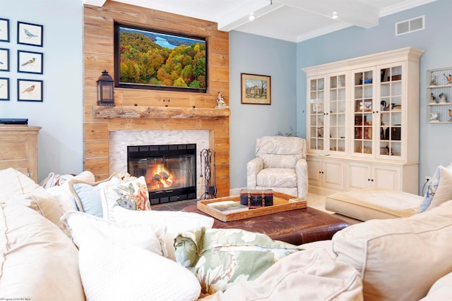 living room with beamed ceiling and crown molding