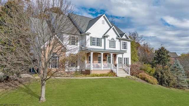 front of property featuring a porch and a front lawn