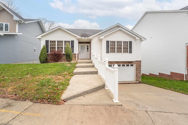 view of front facade featuring a garage and a front yard