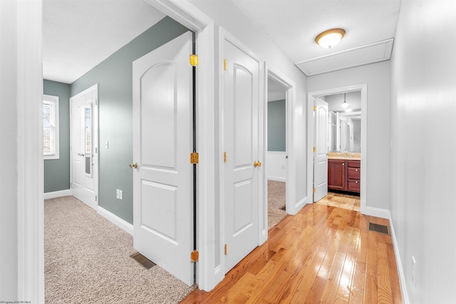 hallway with light wood-type flooring